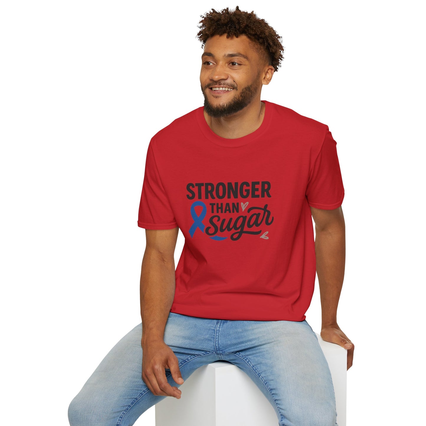 Man seated wearing red Stronger Than Sugar t-shirt — comfortable unisex awareness tee featuring blue ribbon for diabetes strength and positivity.