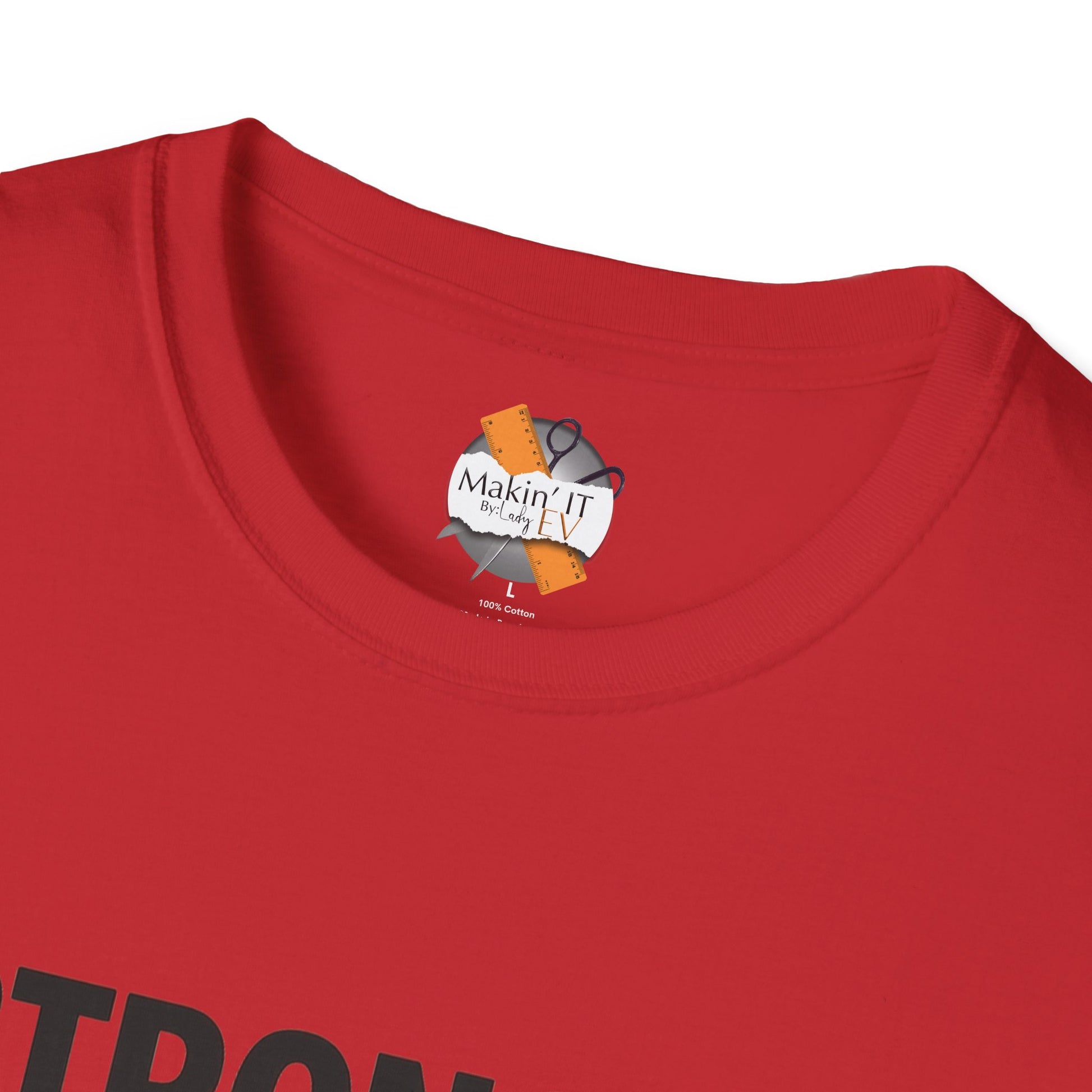 Close-up of Makin’ It By Lady Ev label inside red Stronger Than Sugar t-shirt — soft cotton awareness apparel featuring blue ribbon design.