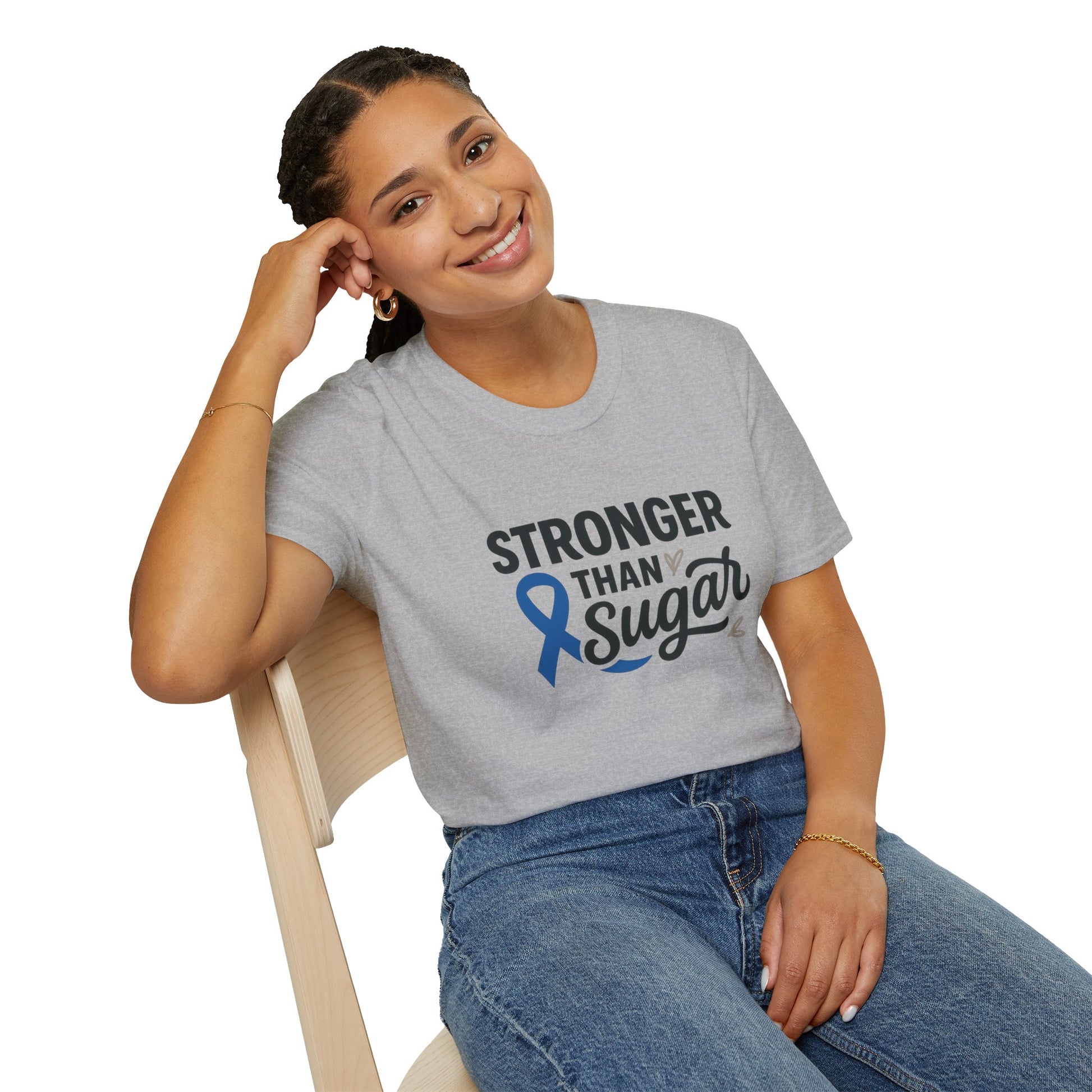 Smiling woman seated wearing Sport Grey Stronger Than Sugar t-shirt — comfortable awareness apparel celebrating hope and health empowerment.