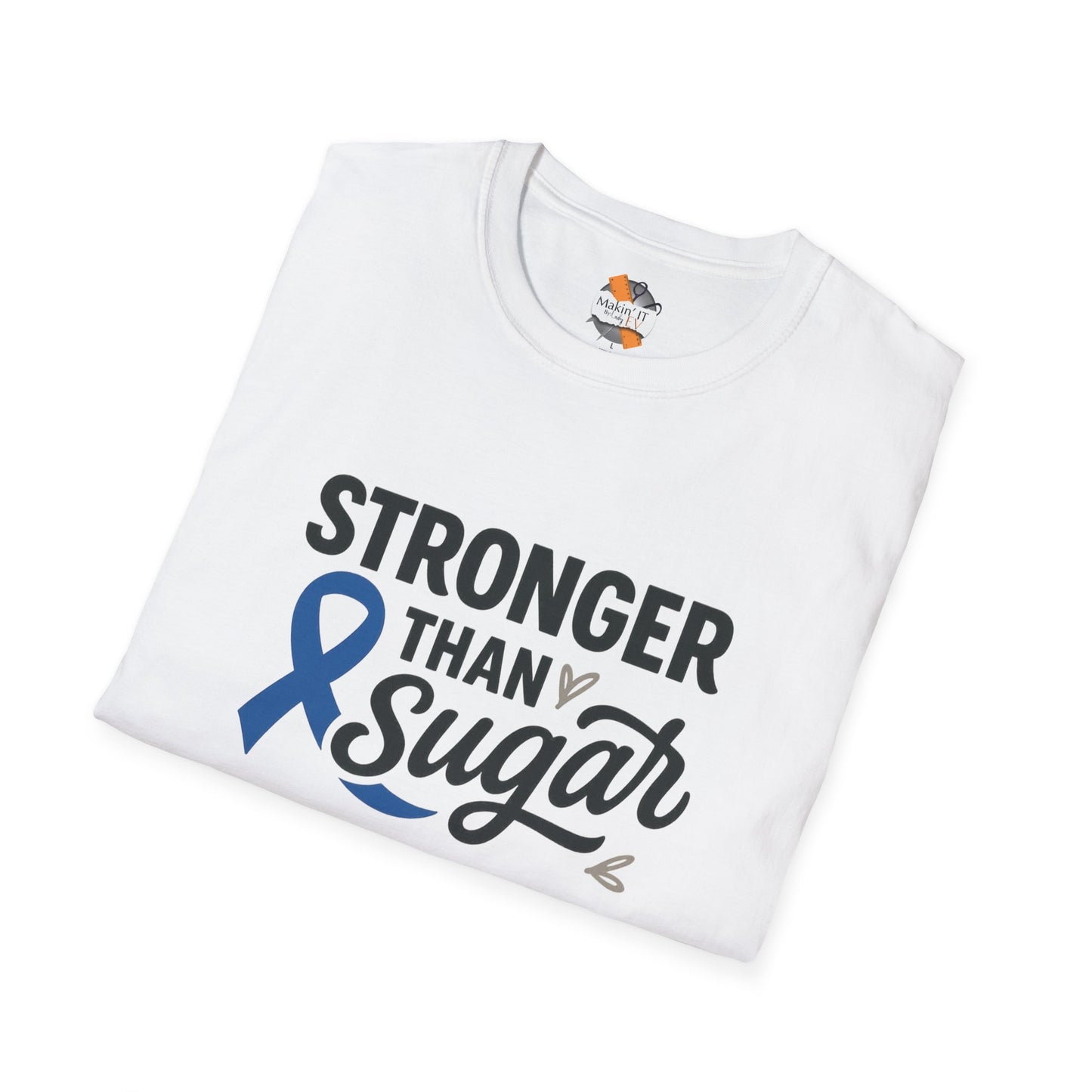 Folded White Stronger Than Sugar t-shirt — soft awareness tee with blue ribbon design promoting diabetes strength and hope.