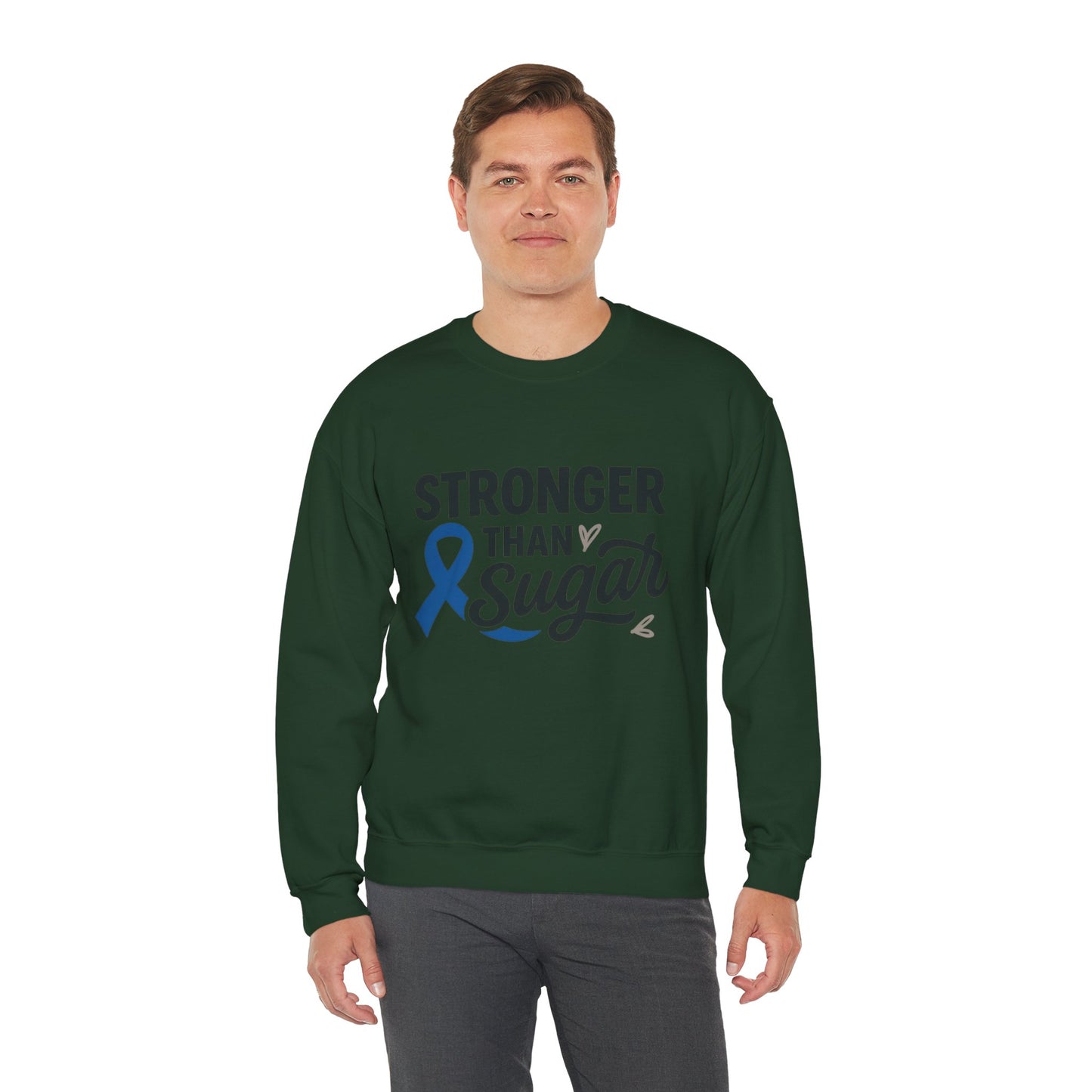 Male model wearing forest green Stronger Than Sugar sweatshirt — unisex crewneck with diabetes awareness ribbon design promoting health advocacy.