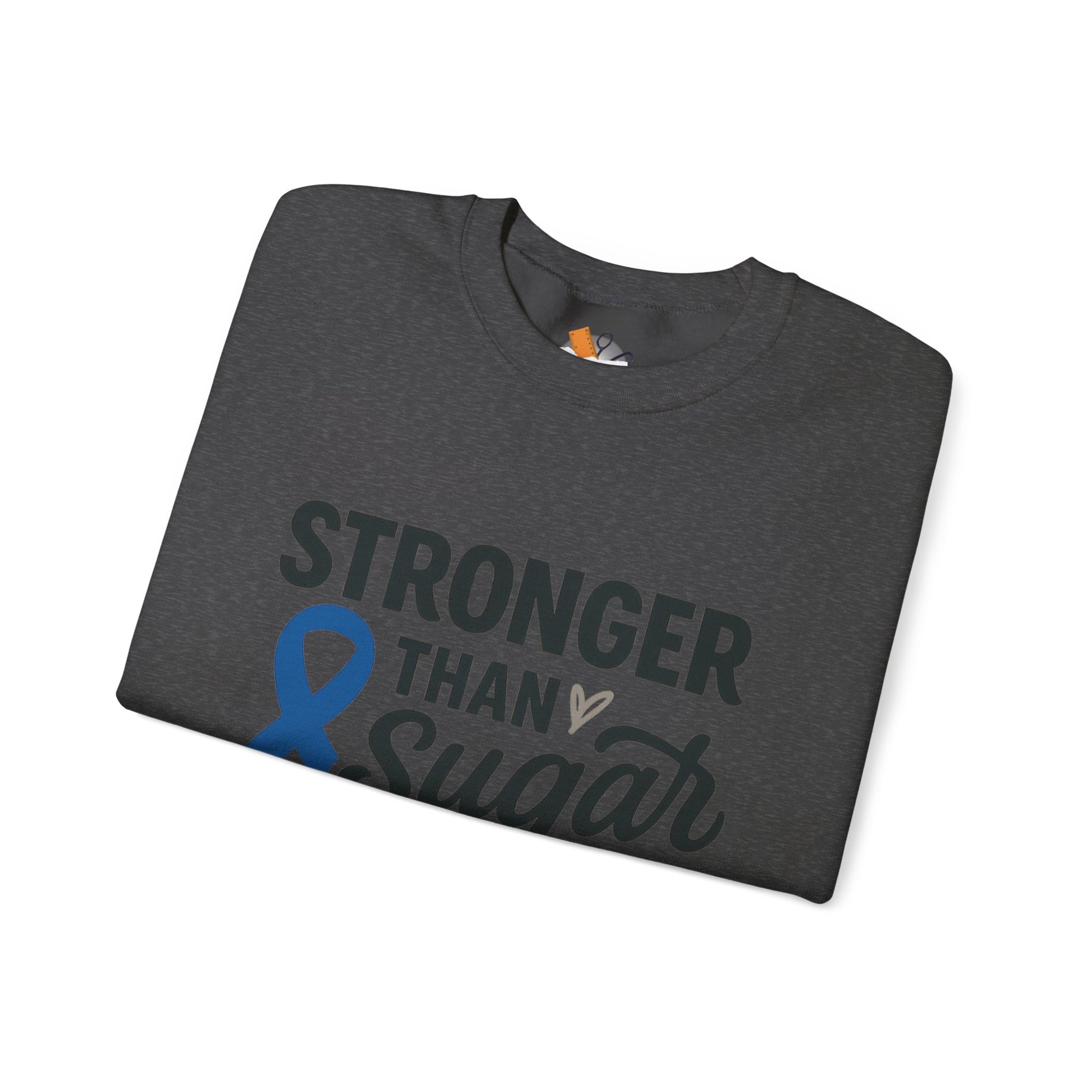 Folded heather gray Stronger Than Sugar crewneck sweatshirt with blue diabetes awareness ribbon — cozy advocacy apparel promoting strength and wellness.
