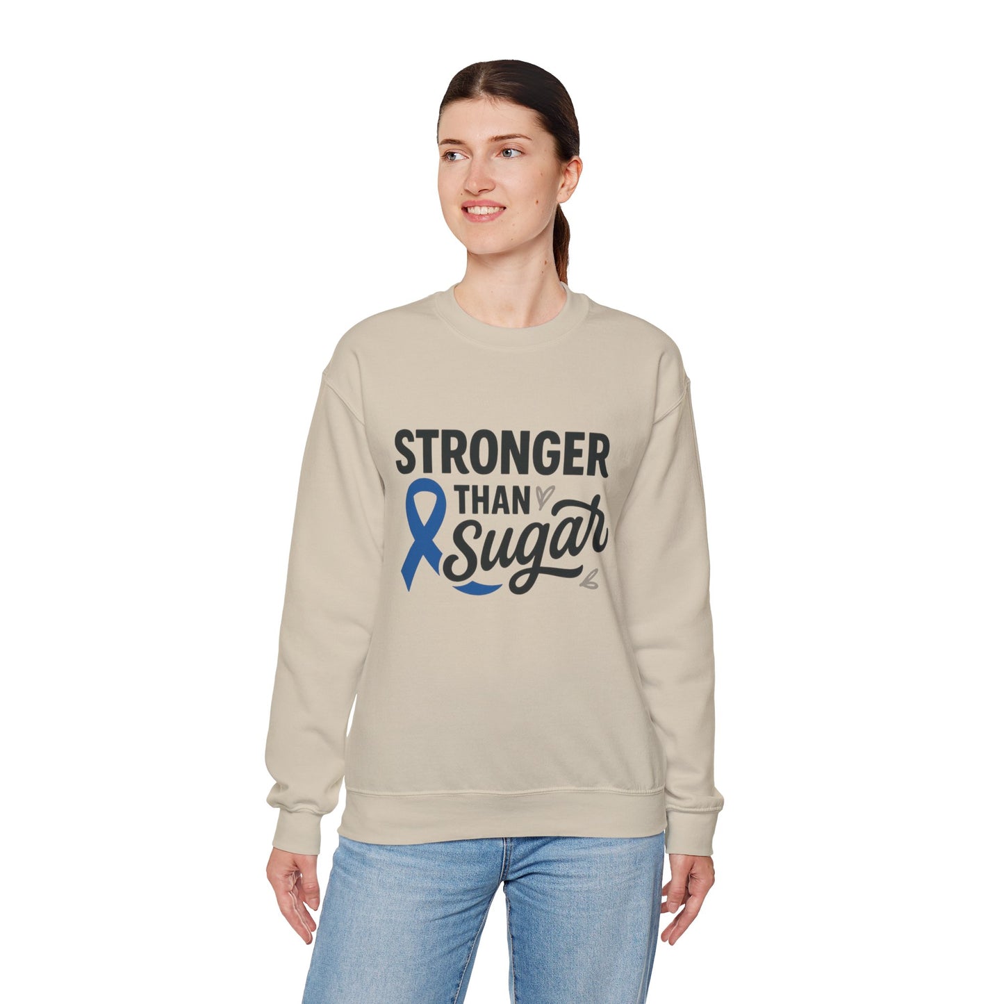 Female model in sand Stronger Than Sugar sweatshirt — cozy unisex awareness apparel with blue ribbon design symbolizing diabetes strength.