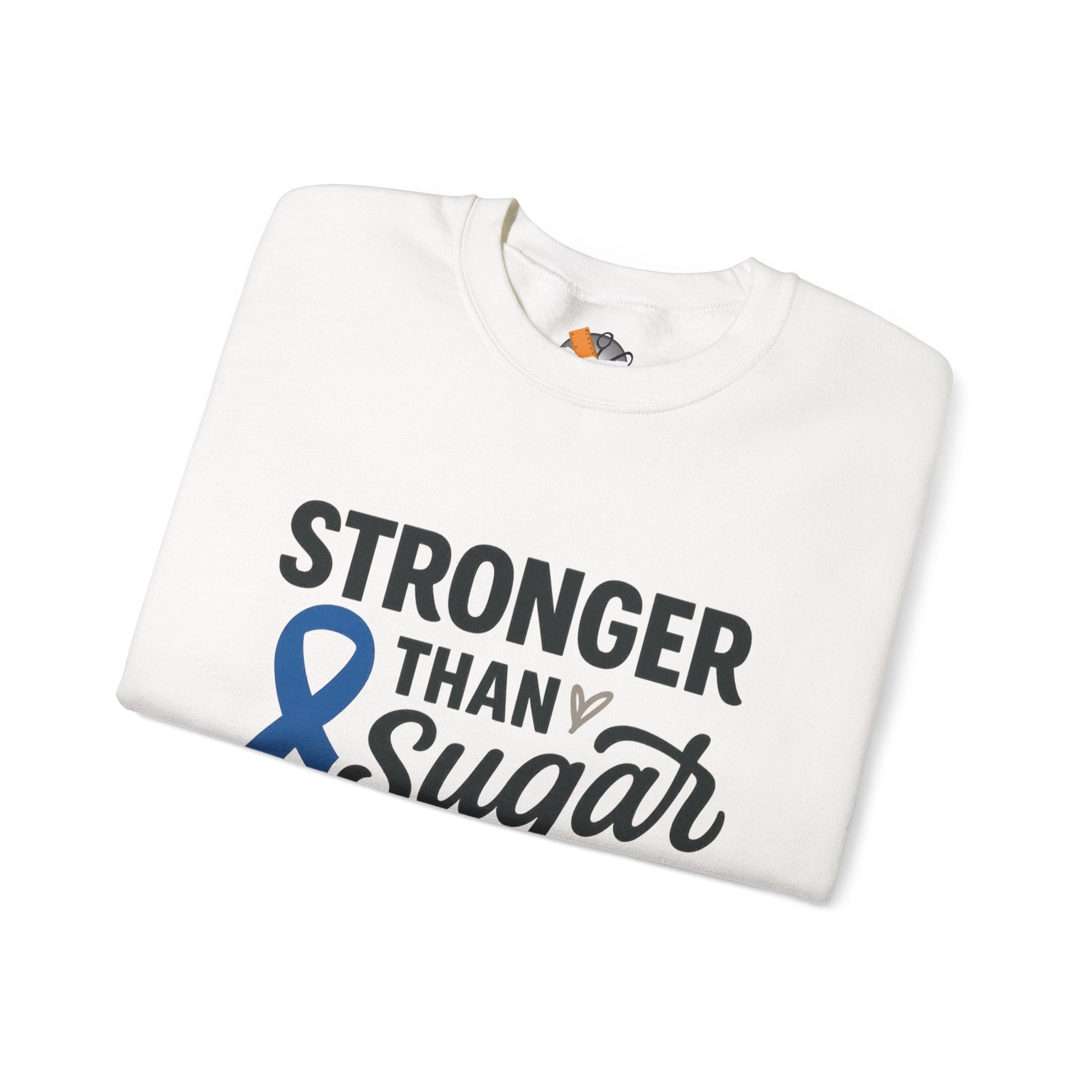 Folded white Stronger Than Sugar sweatshirt with blue diabetes awareness ribbon — cozy unisex fleece symbolizing strength, hope, and resilience.