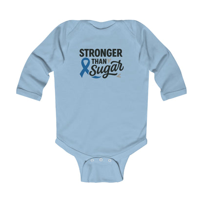 Light blue Stronger Than Sugar infant long sleeve onesie — adorable baby outfit featuring awareness ribbon and uplifting message for diabetic families.