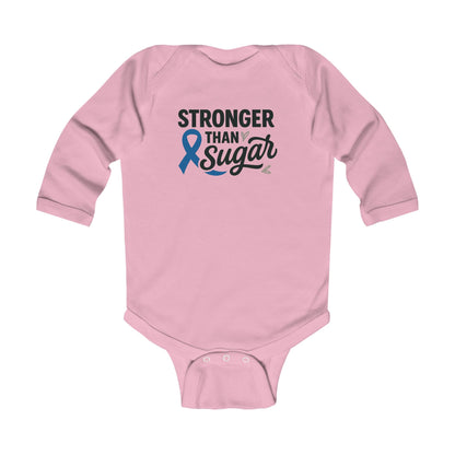 Pink Stronger Than Sugar infant long sleeve onesie — charming awareness bodysuit for baby girls showing love, courage, and diabetic community pride.