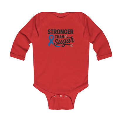 Red Stronger Than Sugar infant long sleeve onesie — bold awareness-themed baby bodysuit celebrating strength, resilience, and diabetes advocacy.
