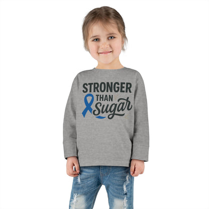 Toddler girl in heather gray Stronger Than Sugar long sleeve shirt — unisex children’s tee supporting diabetes awareness and strength through positivity.