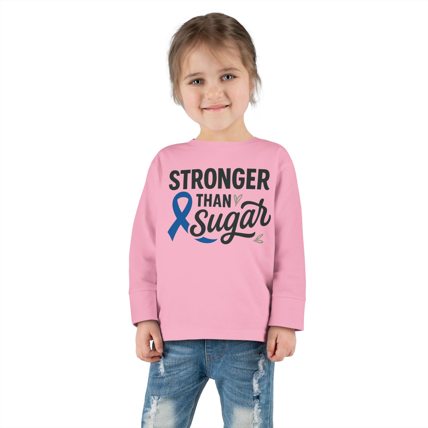 Toddler girl in pink Stronger Than Sugar shirt — kids long sleeve for diabetes awareness and health empowerment from Makin’ It By Lady Ev.