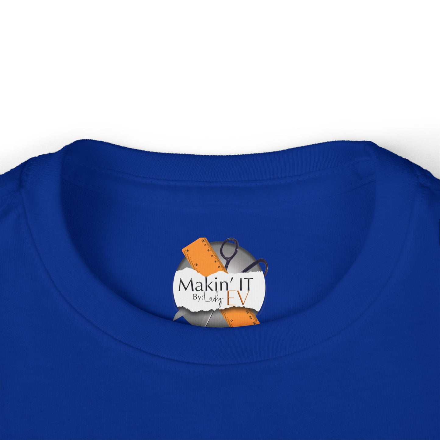 Close-up of Makin’ It By Lady Ev neck label on royal blue Stronger Than Sugar toddler shirt — premium kids awareness apparel with signature branding.