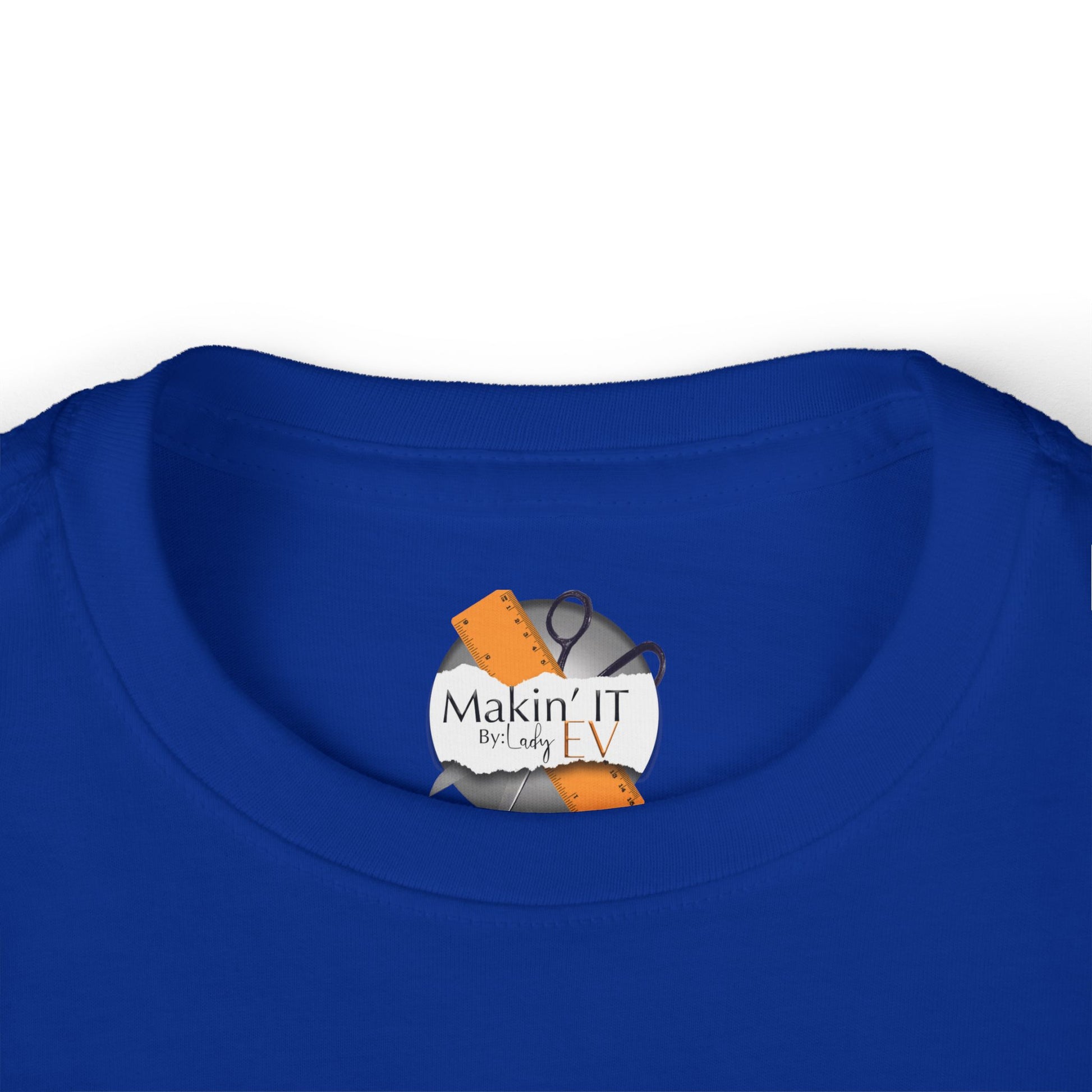 Close-up of Makin’ It By Lady Ev neck label on royal blue Stronger Than Sugar toddler shirt — premium kids awareness apparel with signature branding.