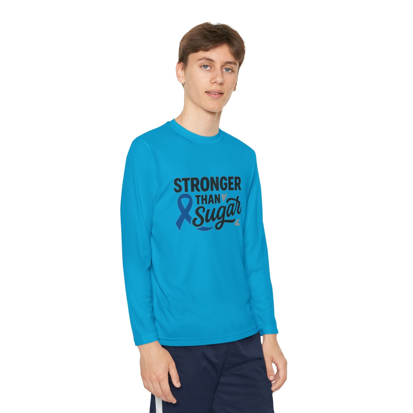 Youth boy wearing Atomic Blue Stronger Than Sugar long sleeve shirt — bright blue diabetes awareness top with ribbon and message of strength.
