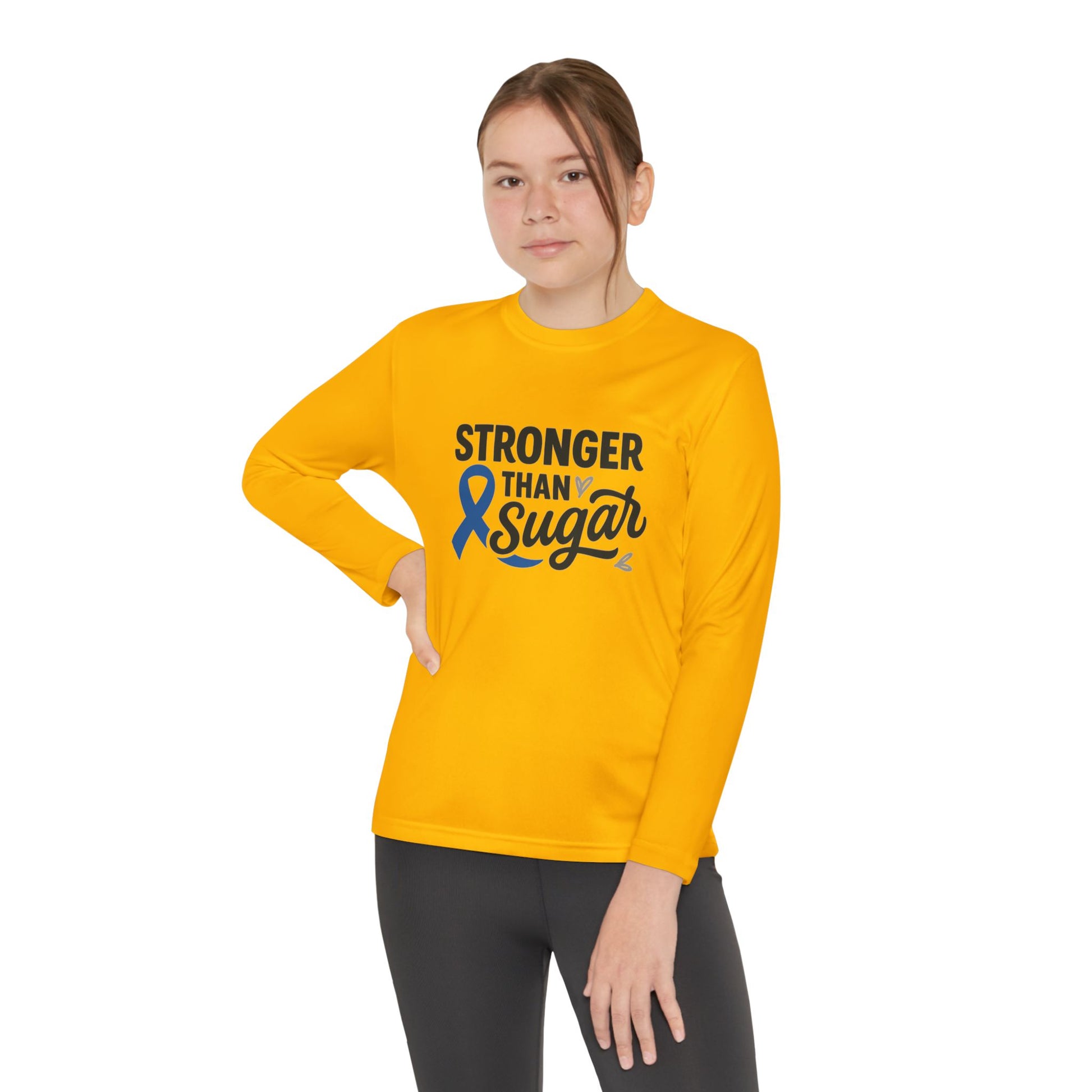 Youth girl in Gold Stronger Than Sugar long sleeve shirt — unisex awareness tee spreading diabetes positivity, unity, and community support.