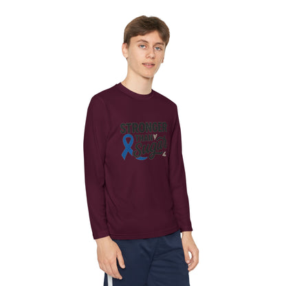 Youth boy in maroon Stronger Than Sugar long sleeve shirt — stylish unisex awareness apparel with blue diabetes ribbon for strength and support.