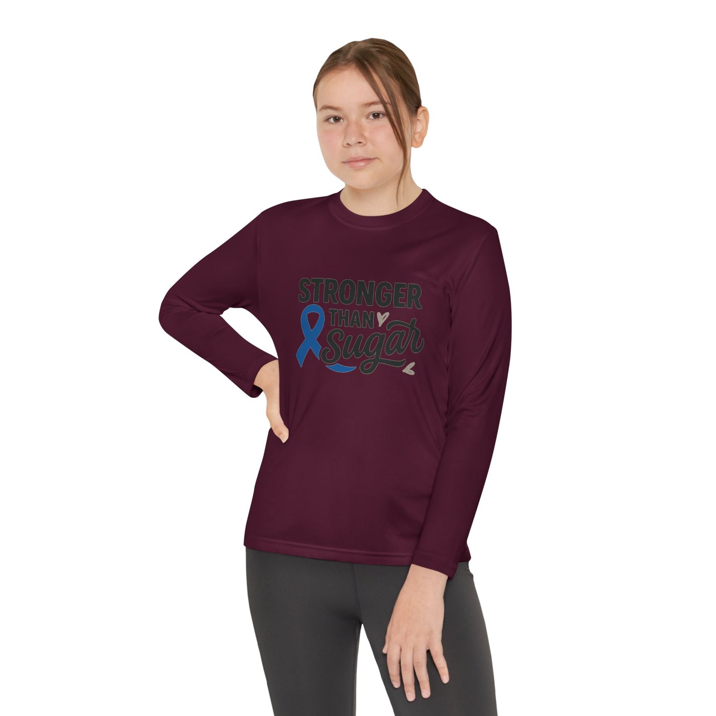 Youth girl in maroon Stronger Than Sugar shirt — empowering awareness long sleeve for diabetes advocacy, courage, and community pride.