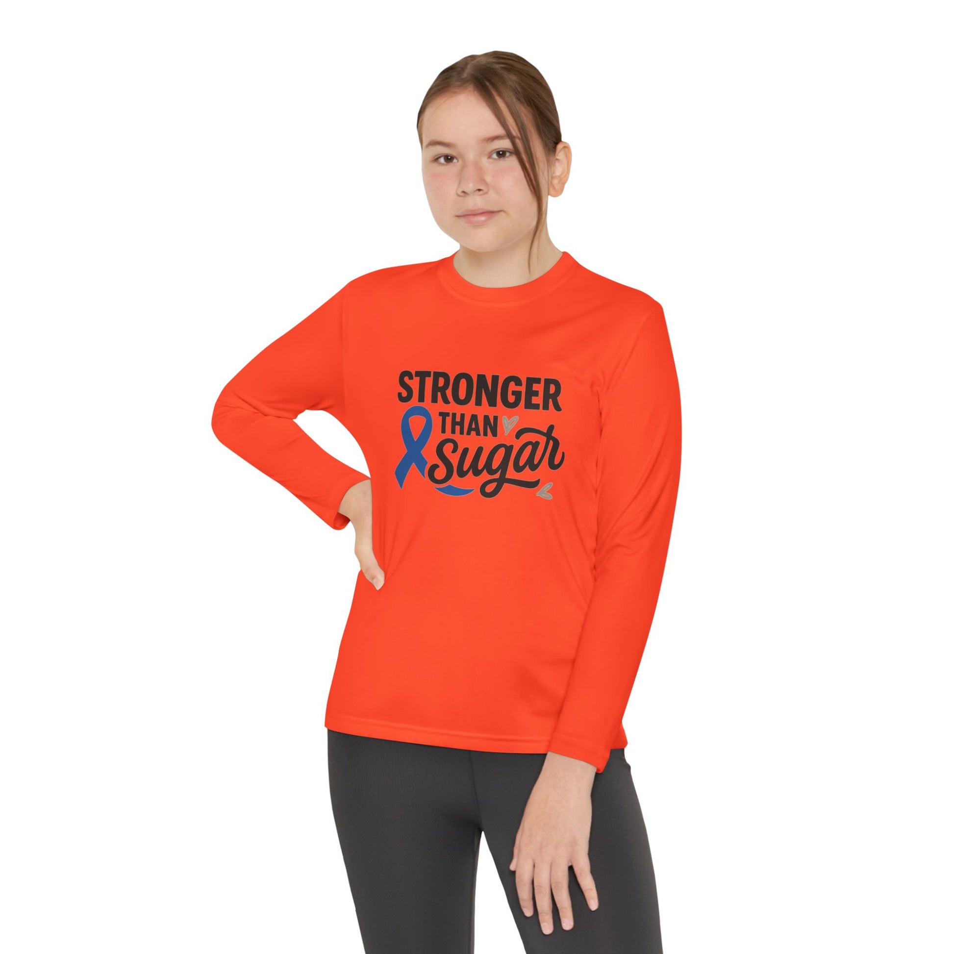 Youth girl wearing Neon Orange Stronger Than Sugar long sleeve shirt — bright diabetes awareness tee inspiring strength, advocacy, and positivity.