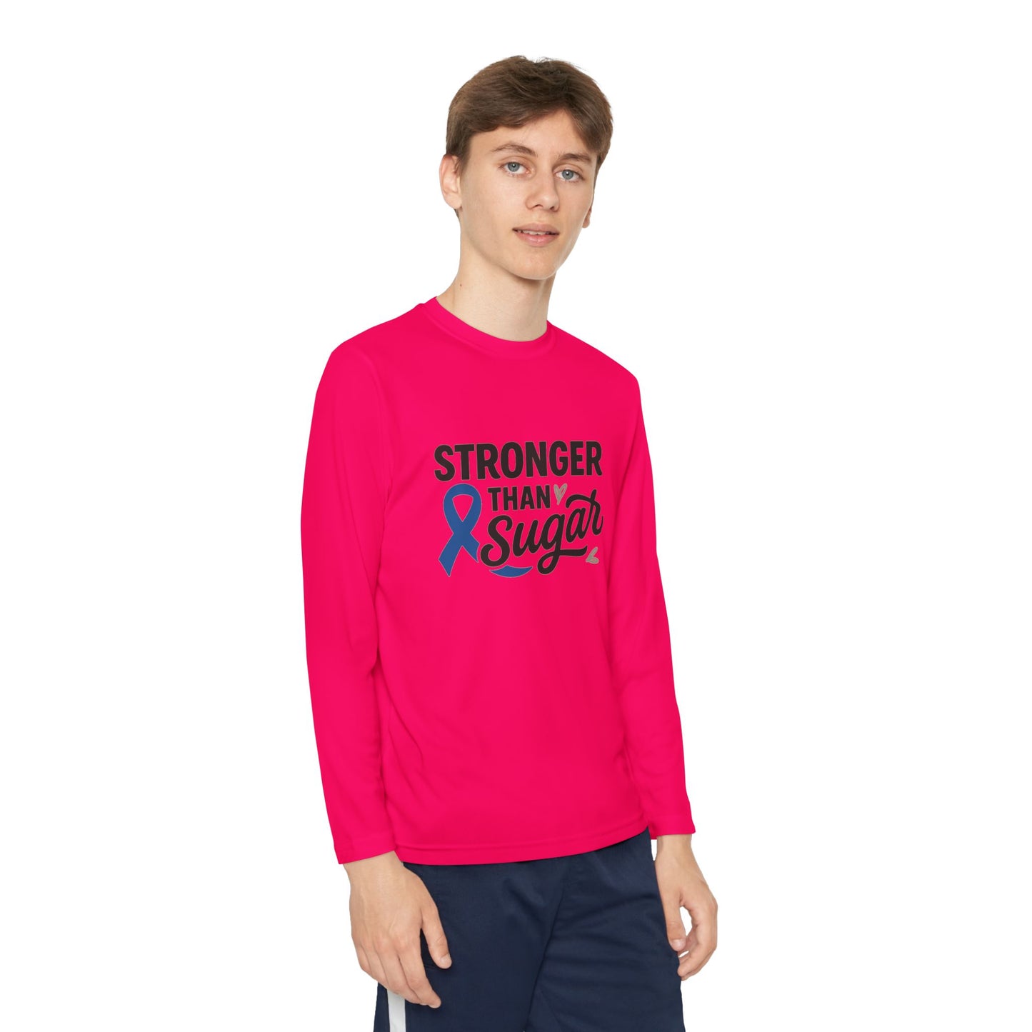 Youth boy wearing pink raspberry Stronger Than Sugar shirt — bright long sleeve awareness top featuring blue diabetes ribbon for health advocacy.
