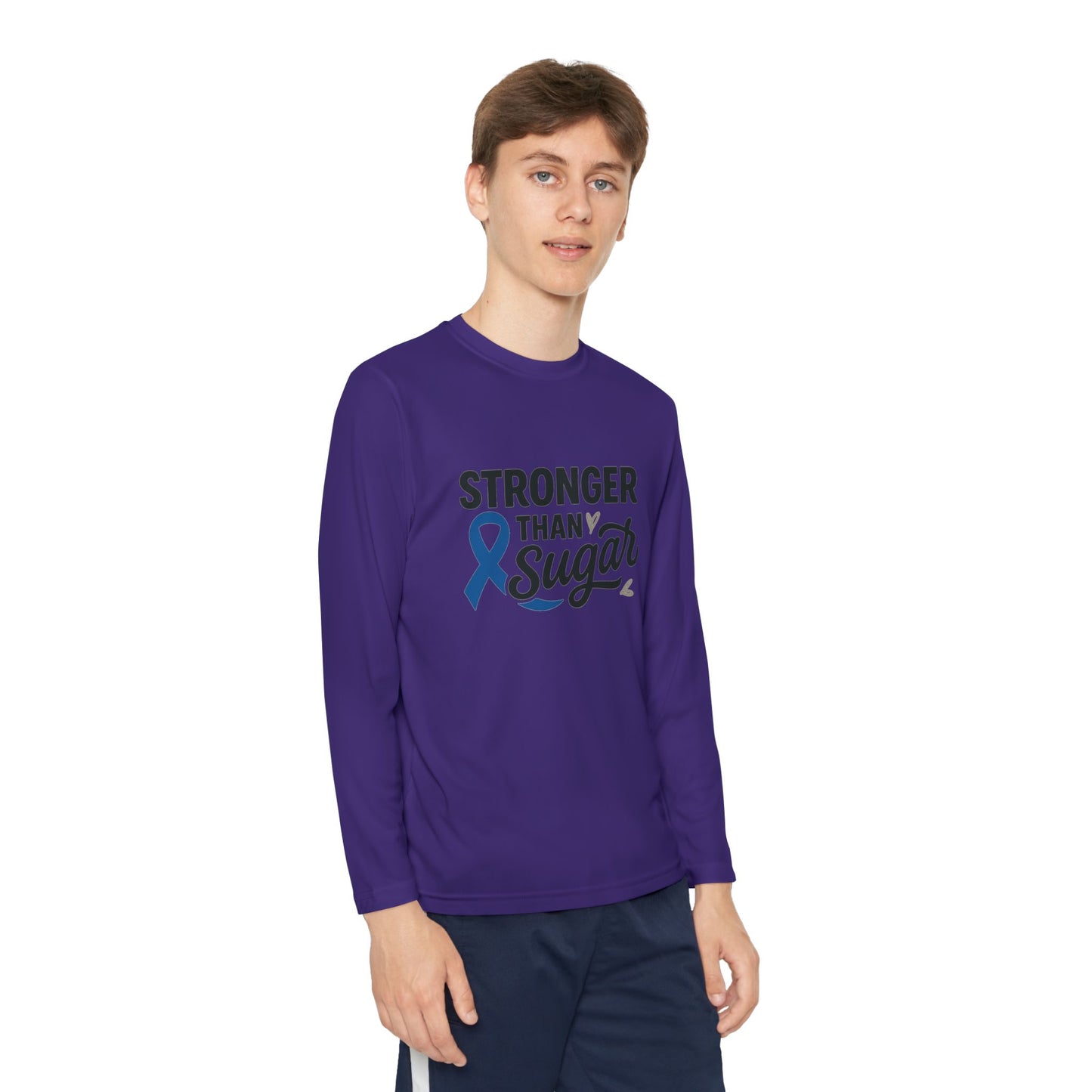 Youth boy wearing purple Stronger Than Sugar long sleeve shirt — unisex diabetes awareness tee with blue ribbon design for health advocacy.