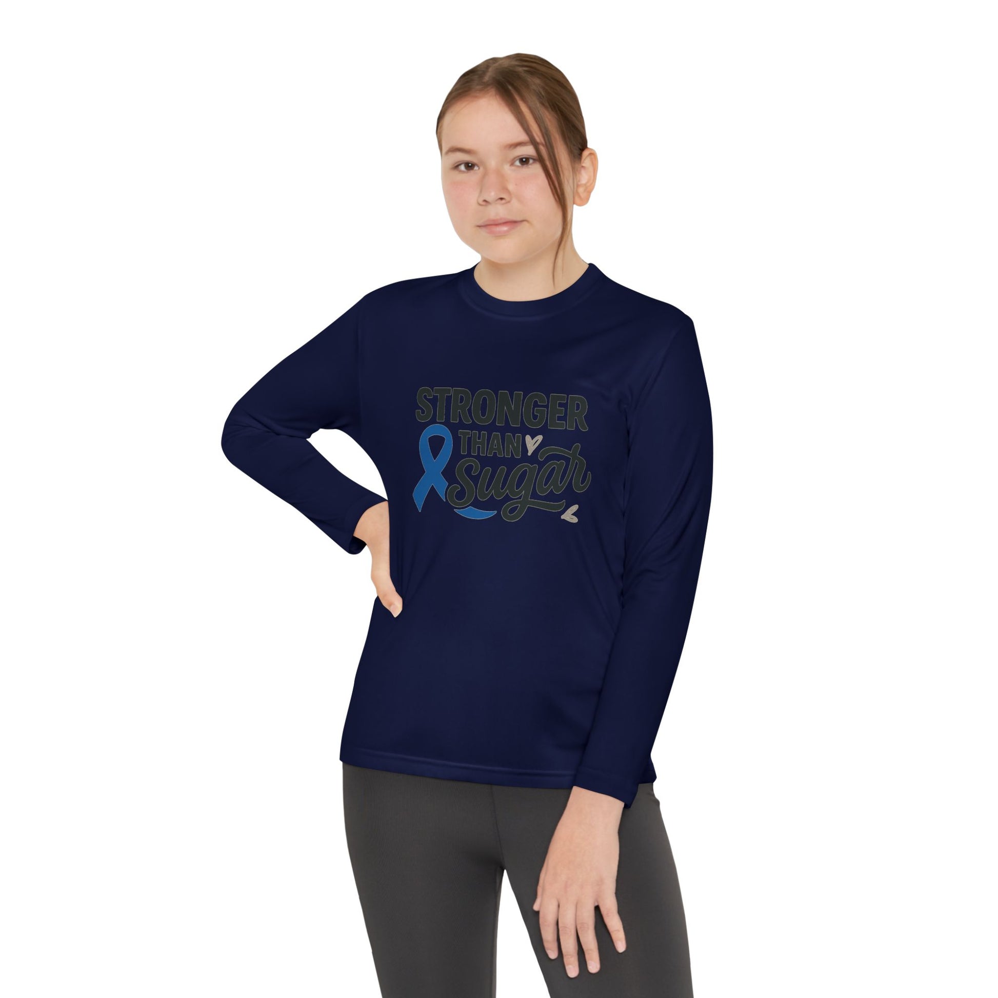 Youth girl in True Navy Stronger Than Sugar long sleeve shirt — bold awareness apparel for diabetes advocacy, empowerment, and unity.