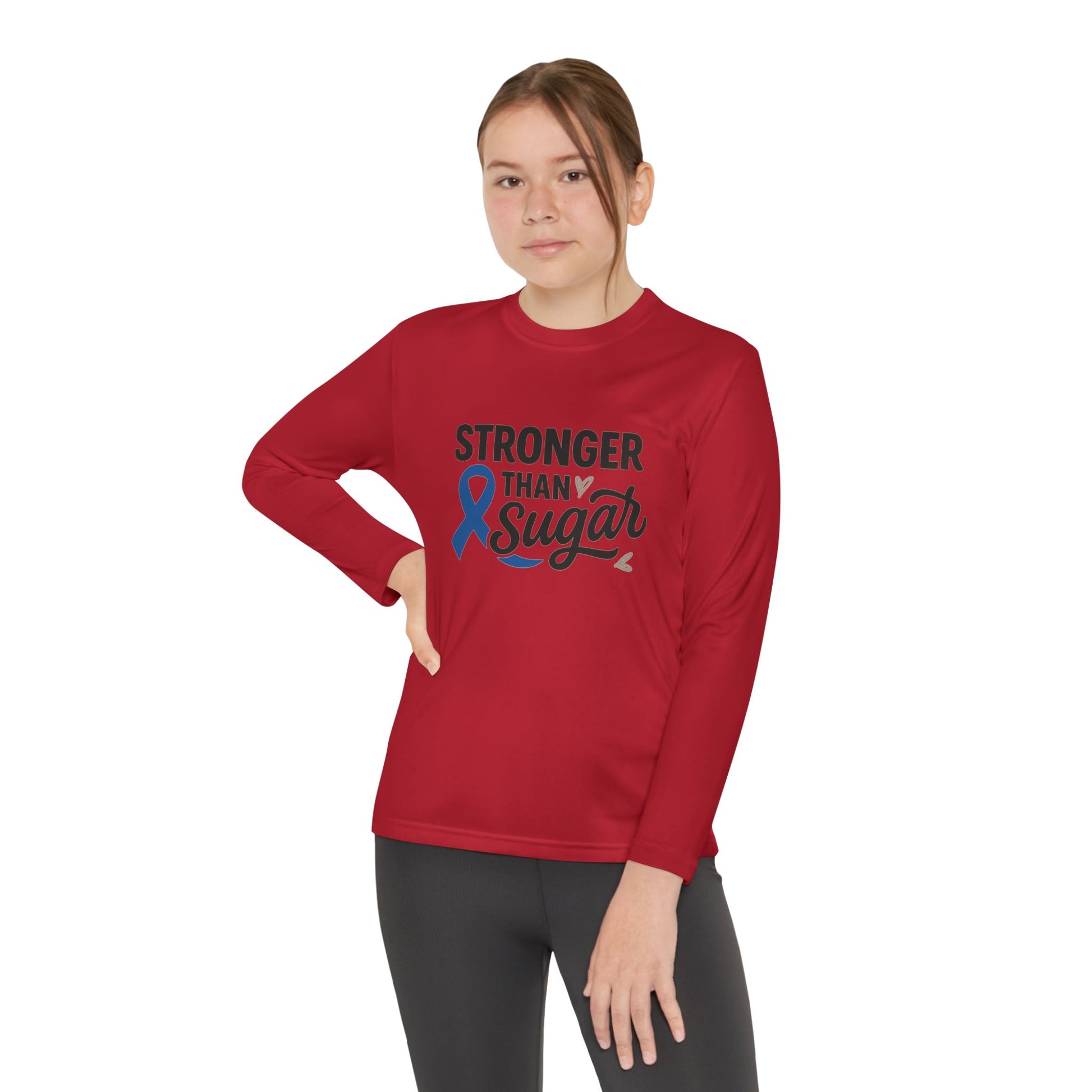 Youth girl in true red Stronger Than Sugar long sleeve shirt — motivational diabetes awareness tee encouraging courage, health, and unity.