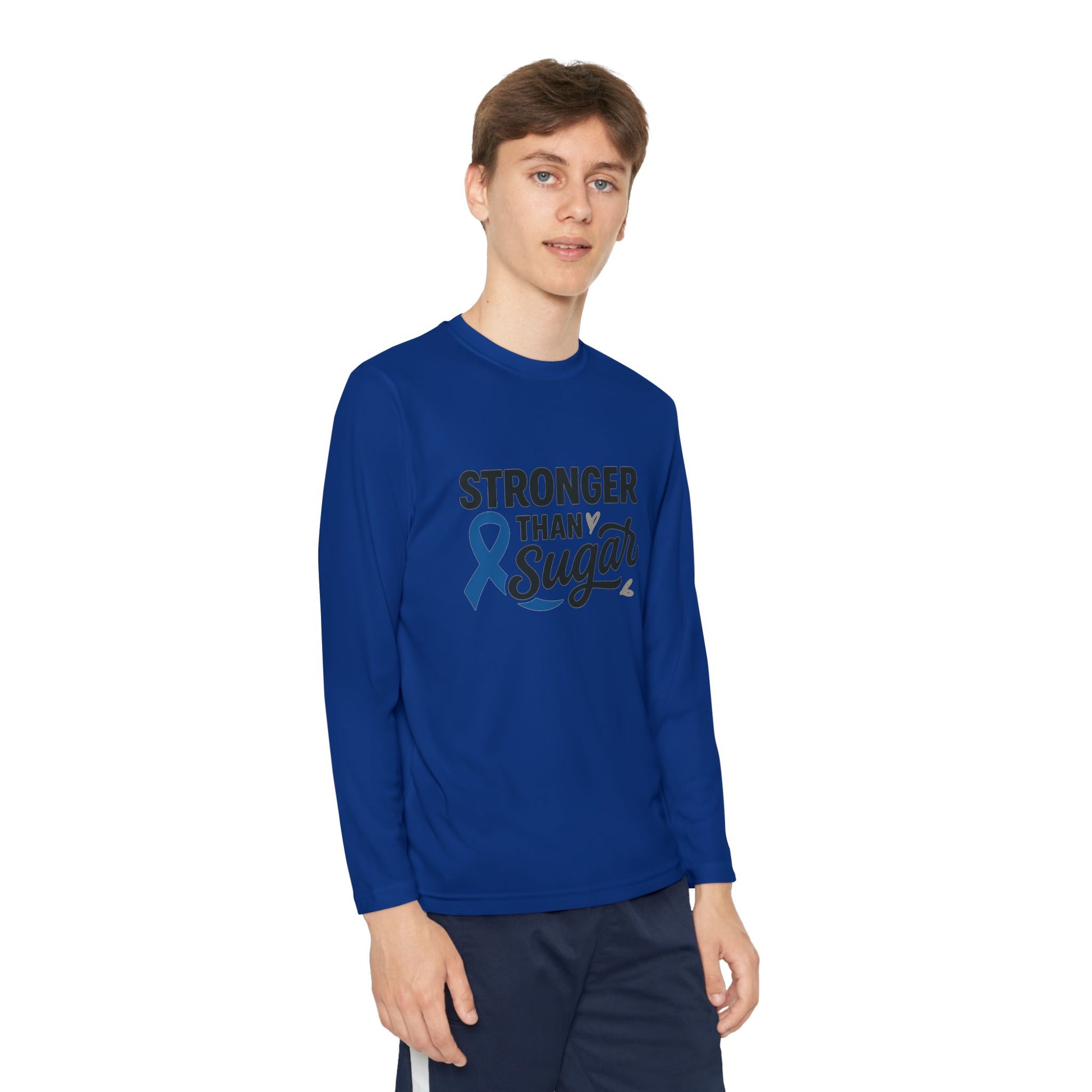 Youth boy in True Royal Stronger Than Sugar long sleeve shirt — vibrant diabetes awareness top featuring blue ribbon and inspiring message of strength.