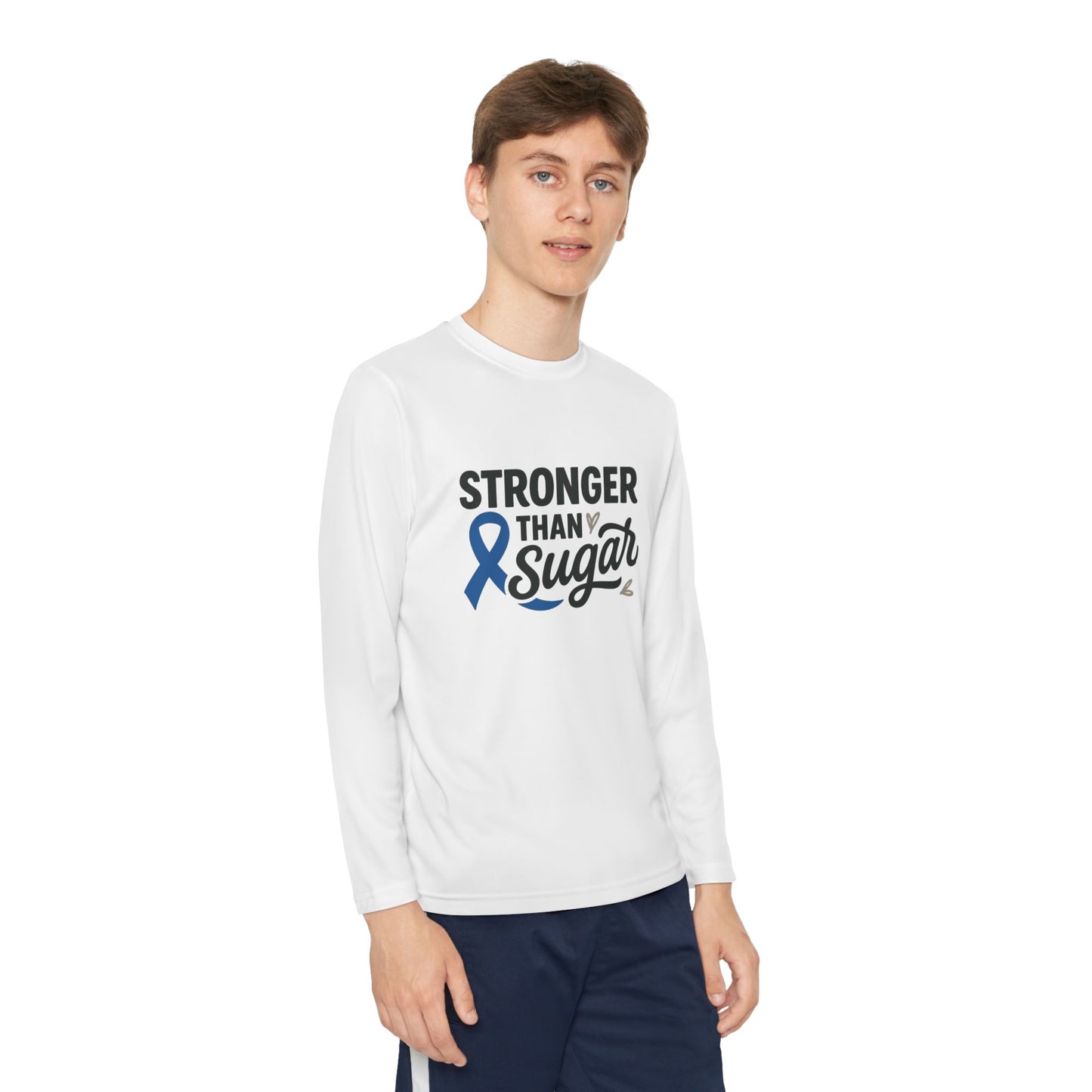Youth boy wearing White Stronger Than Sugar long sleeve shirt — unisex diabetes awareness tee featuring blue ribbon design and positive message.