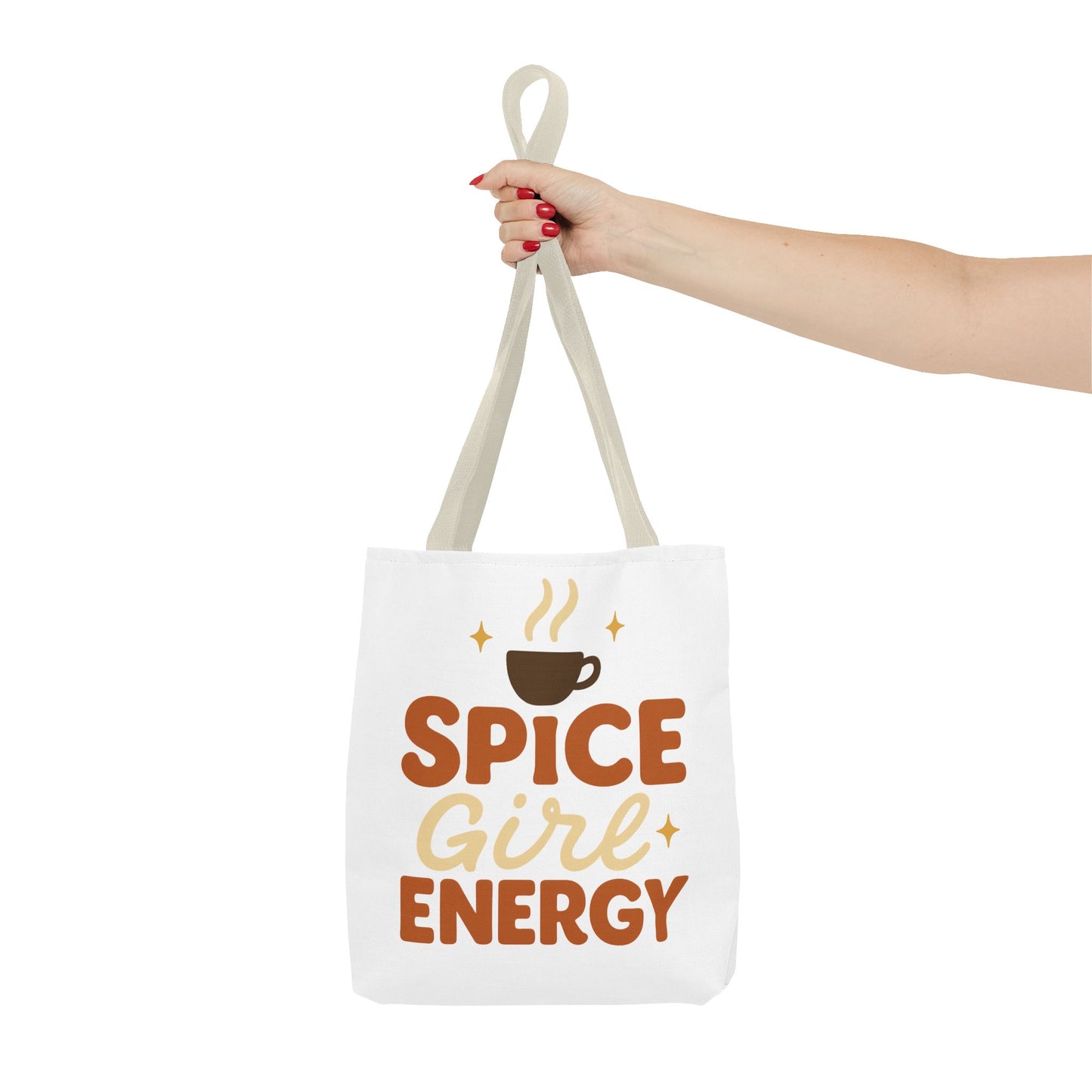 Beige-handled white “Spice Girl Energy” tote bag held in hand — stylish fall tote for coffee lovers and everyday use.
