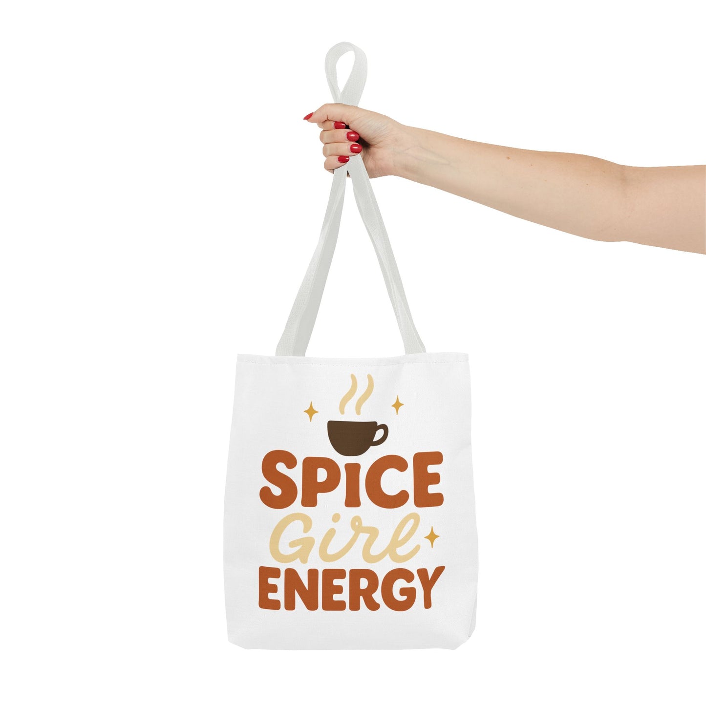 White-handled “Spice Girl Energy” tote bag held in hand — minimalist coffee-inspired tote for fall fashion and daily use.