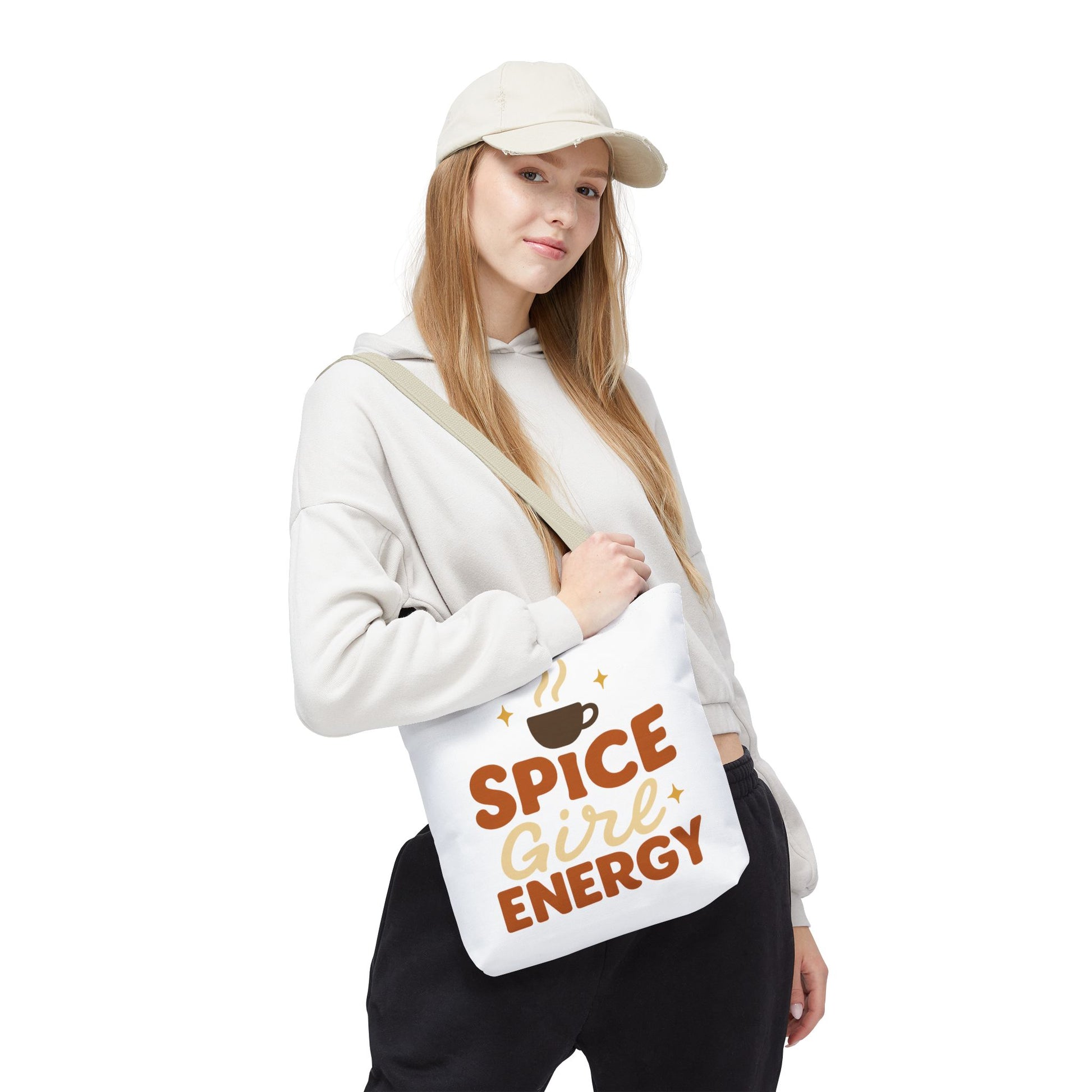 Woman wearing white “Spice Girl Energy” tote bag with beige straps — modern fall tote bag for cozy coffee runs and casual outfits.