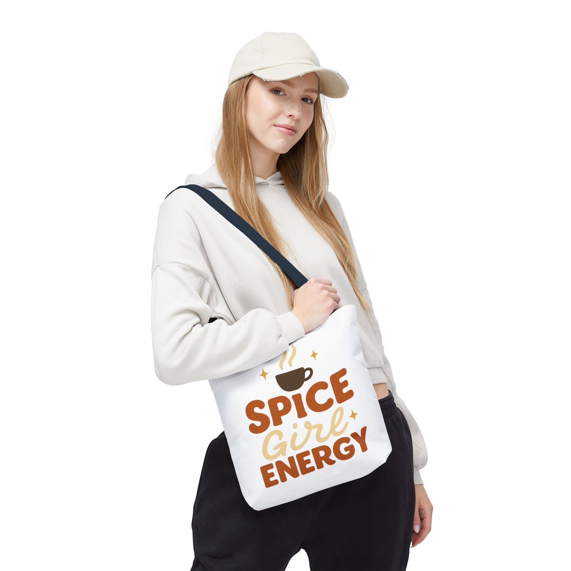 Model wearing white “Spice Girl Energy” tote bag with navy straps — cozy coffee-inspired fall tote for everyday wear.