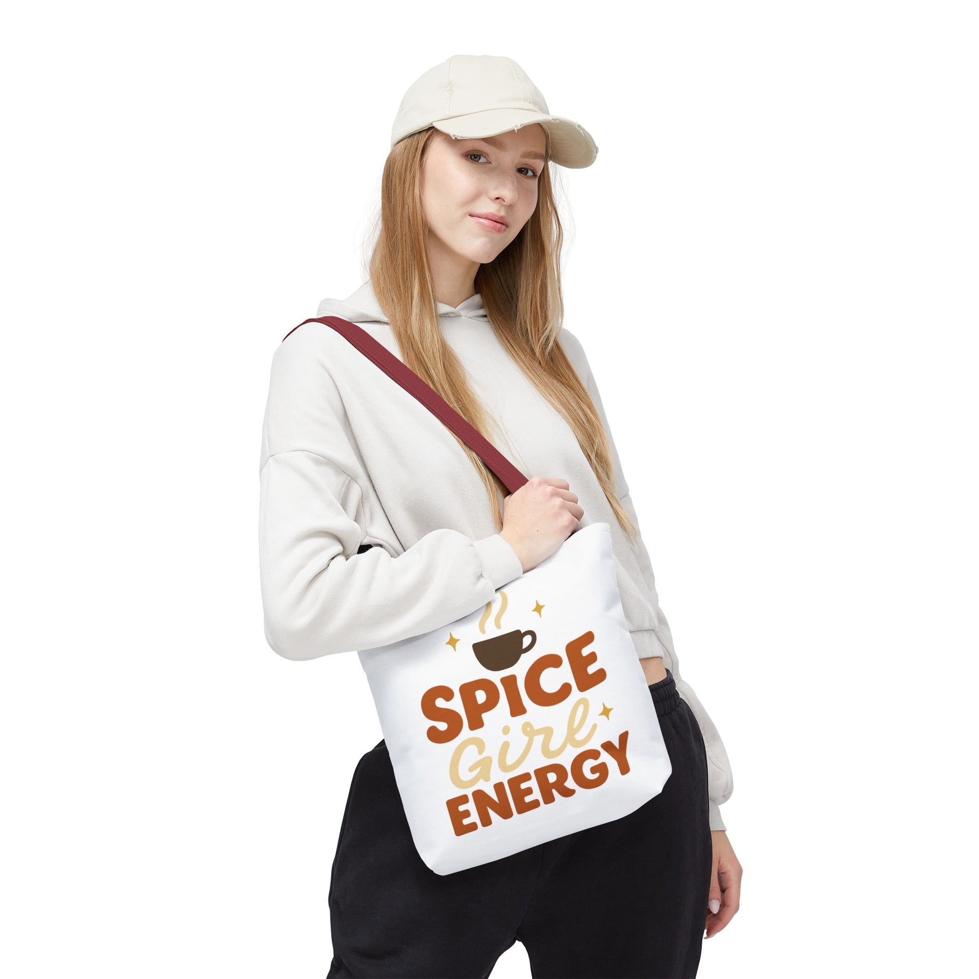 Woman wearing white “Spice Girl Energy” tote bag with red handles — fall coffee aesthetic tote for cozy outfits and warm-toned style.