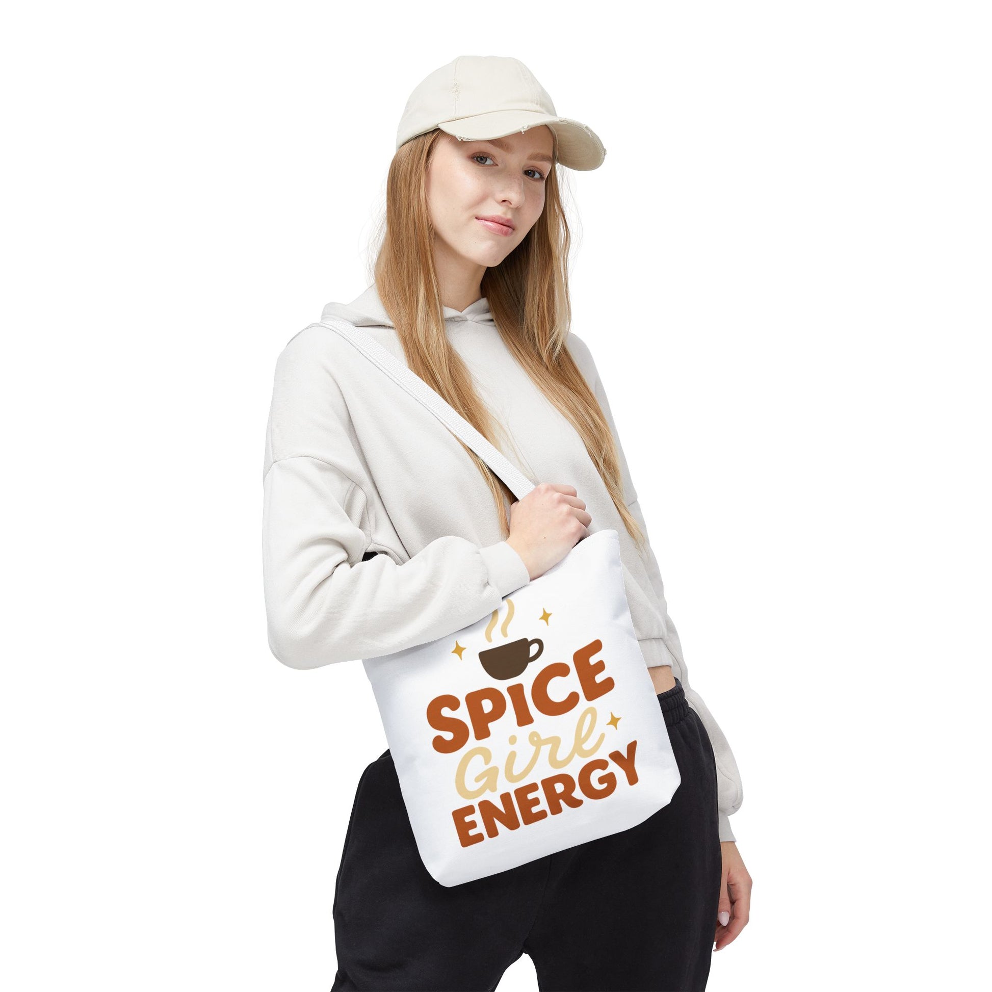 Model wearing white “Spice Girl Energy” tote bag with white straps — cozy fall tote for coffee dates and casual autumn style.