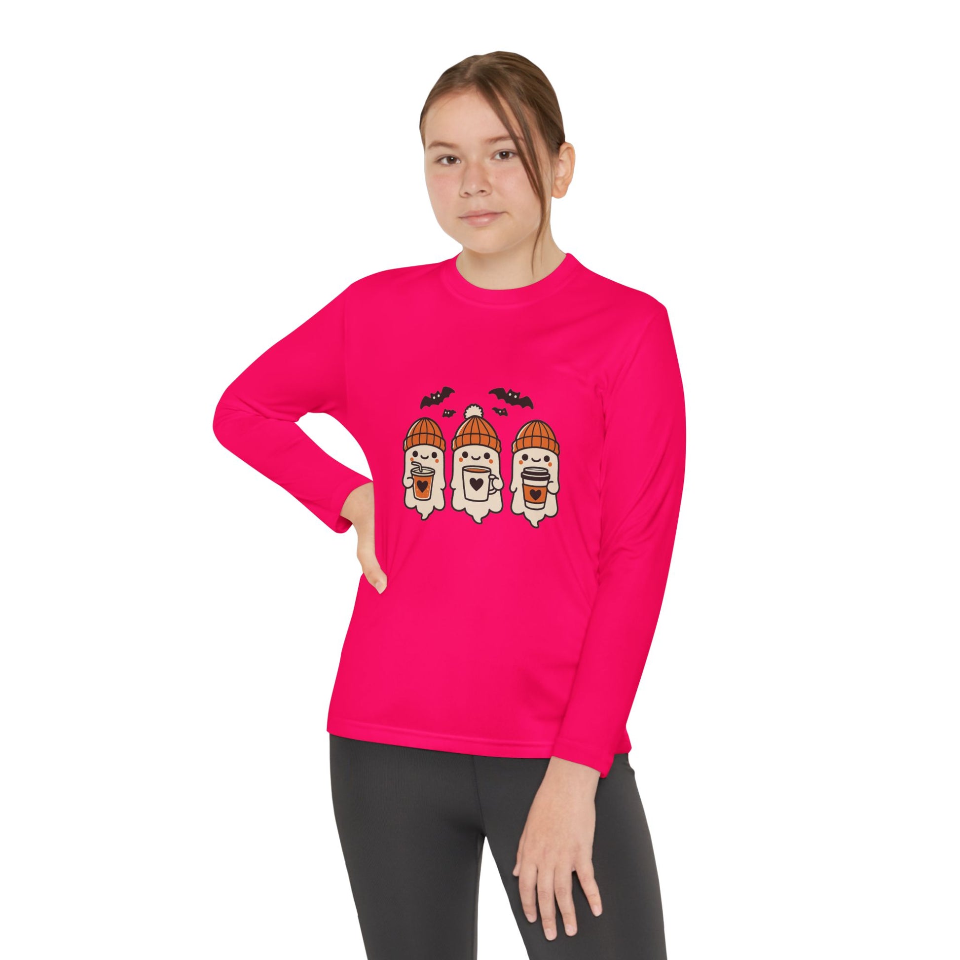Girl modeling Makin’ It By Lady Ev pink long sleeve Halloween shirt with three ghosts in beanies.