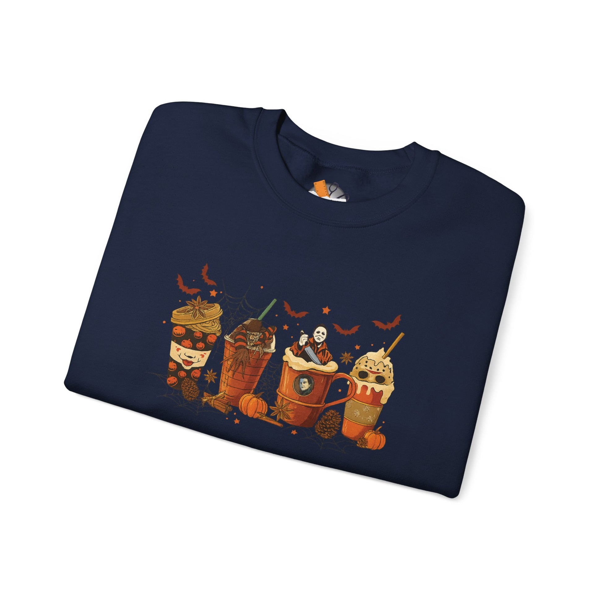 Folded navy Gildan 18000 crewneck sweatshirt with Halloween horror coffee drinks graphic featuring spooky characters, pumpkins, and bats.