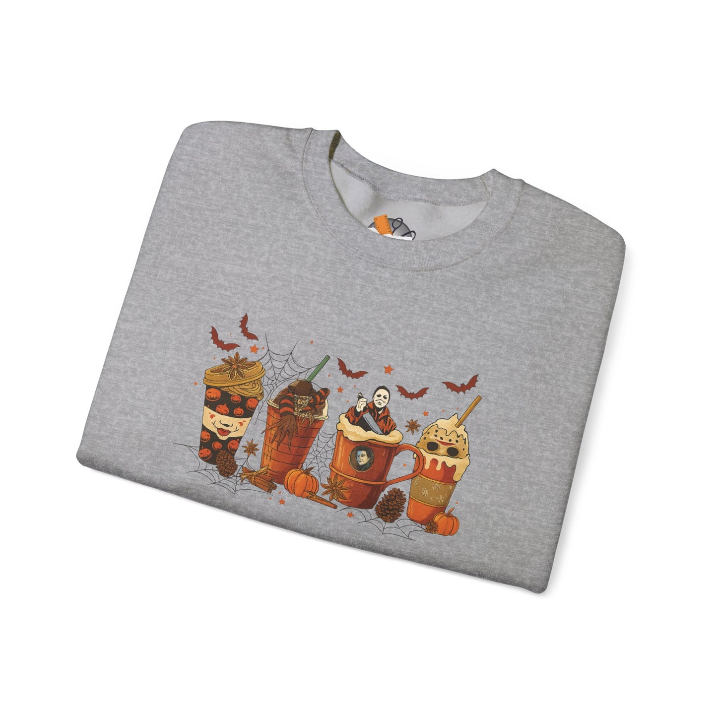Folded Sport Gray Gildan 18000 crewneck sweatshirt with spooky Halloween horror coffee drinks graphic featuring bats, pumpkins, and creepy characters.